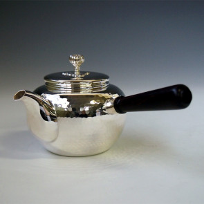 No.yk6bs,Silver teapot with ebony handle, design is beaten surface (large),about 0.2L